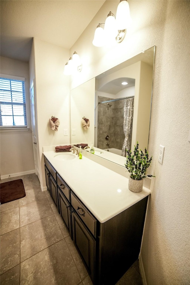 bathroom with baseboards, tile patterned flooring, vanity, and a shower with curtain