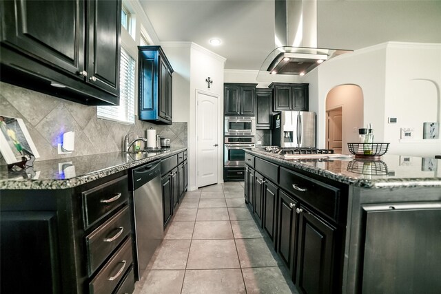 kitchen with a center island, stainless steel appliances, light tile patterned flooring, and island exhaust hood