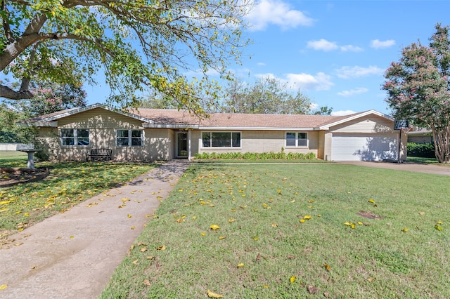 single story home featuring a garage and a front lawn