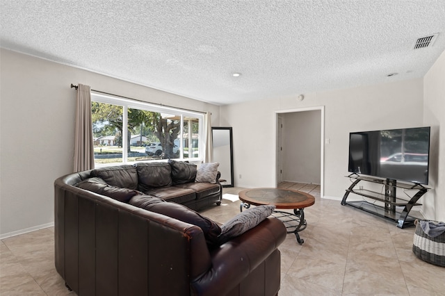 living room with a textured ceiling