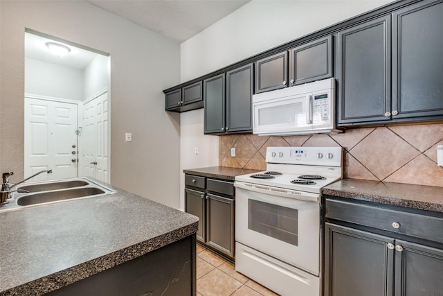 kitchen with decorative backsplash, light tile patterned floors, white appliances, and sink