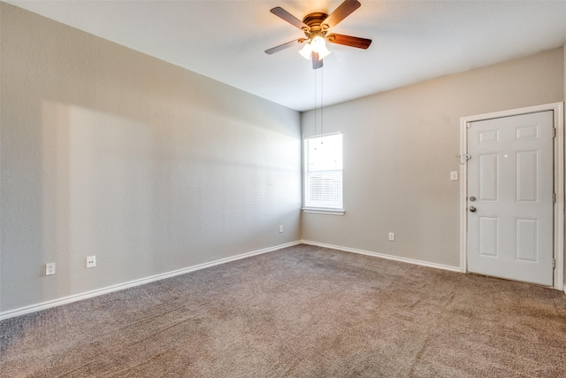 empty room with carpet flooring and ceiling fan