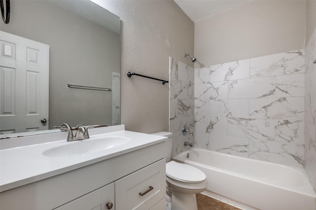 full bathroom featuring toilet, vanity, and tiled shower / bath