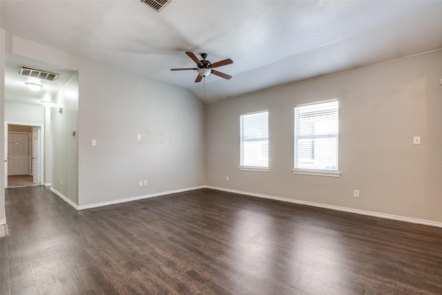 empty room with ceiling fan, lofted ceiling, and dark hardwood / wood-style floors