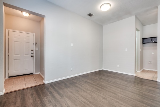 empty room featuring wood-type flooring