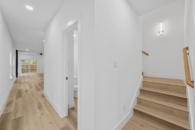 stairs with hardwood / wood-style floors