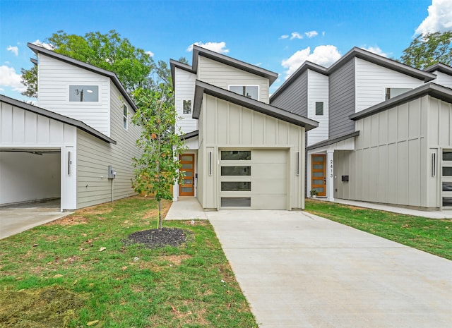 view of front of property with a garage and a front yard