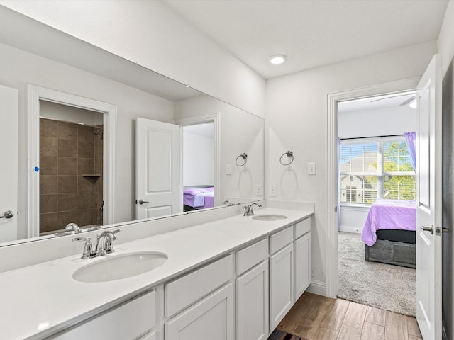 bathroom featuring hardwood / wood-style floors and vanity