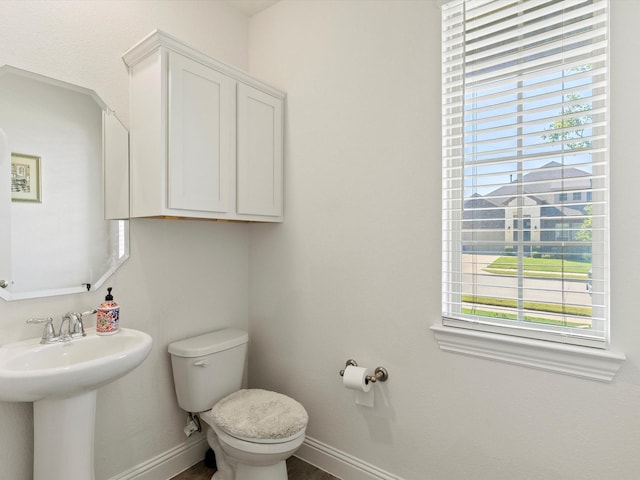 bathroom with toilet and sink