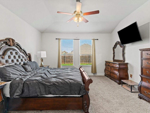 carpeted bedroom with ceiling fan and lofted ceiling