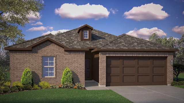 view of front of property with a garage and a front lawn