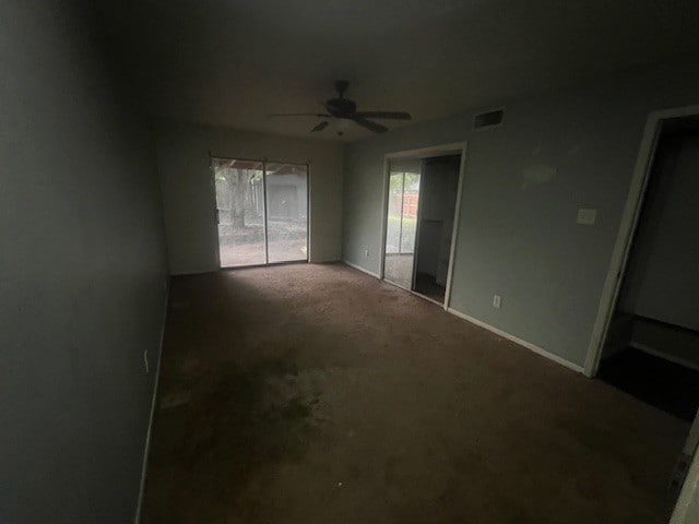 unfurnished bedroom with ceiling fan and carpet floors