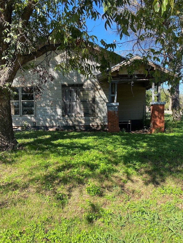 exterior space with a yard