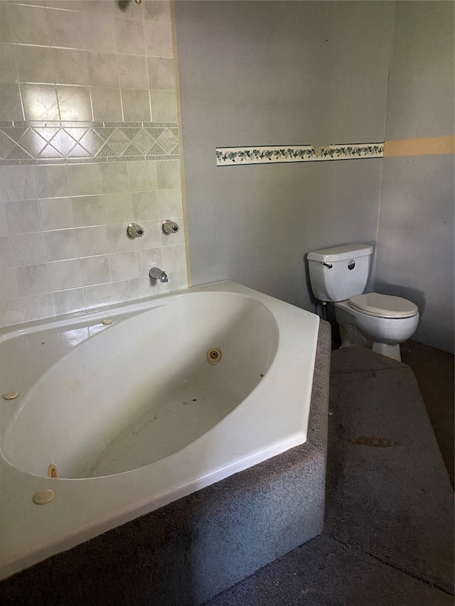 bathroom with toilet and a bathing tub