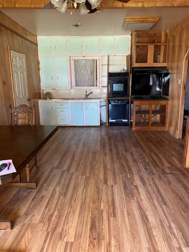 kitchen featuring hardwood / wood-style floors, ceiling fan, and sink