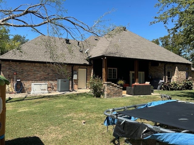 rear view of house with a yard, an outdoor hangout area, cooling unit, and a patio area