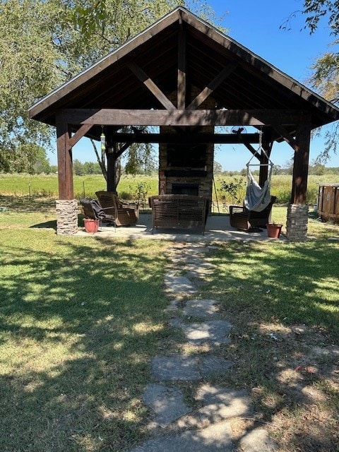 view of community with a gazebo, a patio area, and a lawn