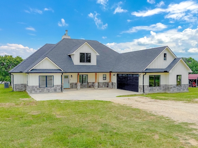 exterior space featuring a front lawn and a garage