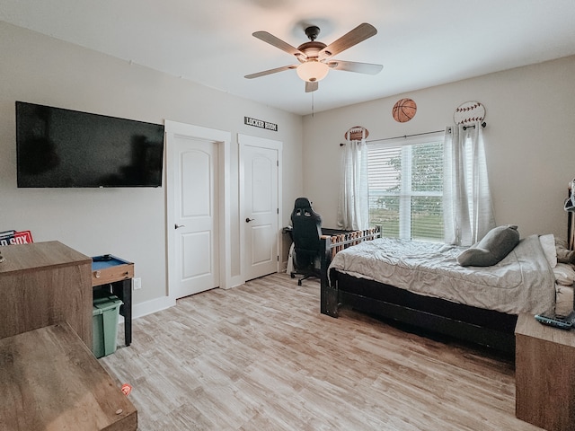 bedroom featuring ceiling fan and wood-type flooring