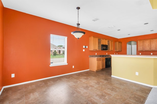 kitchen featuring stainless steel gas cooktop and decorative light fixtures