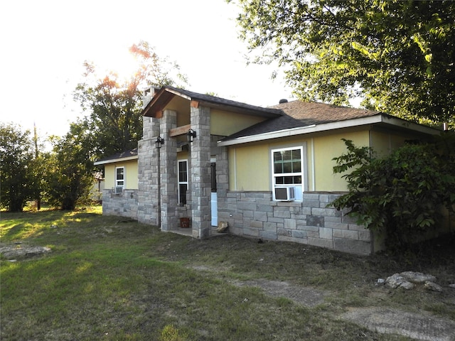 view of home's exterior with a lawn and cooling unit