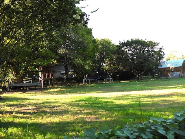 view of yard featuring a trampoline