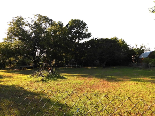 view of yard featuring a trampoline