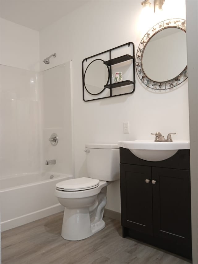 full bathroom featuring shower / tub combination, wood-type flooring, toilet, and vanity