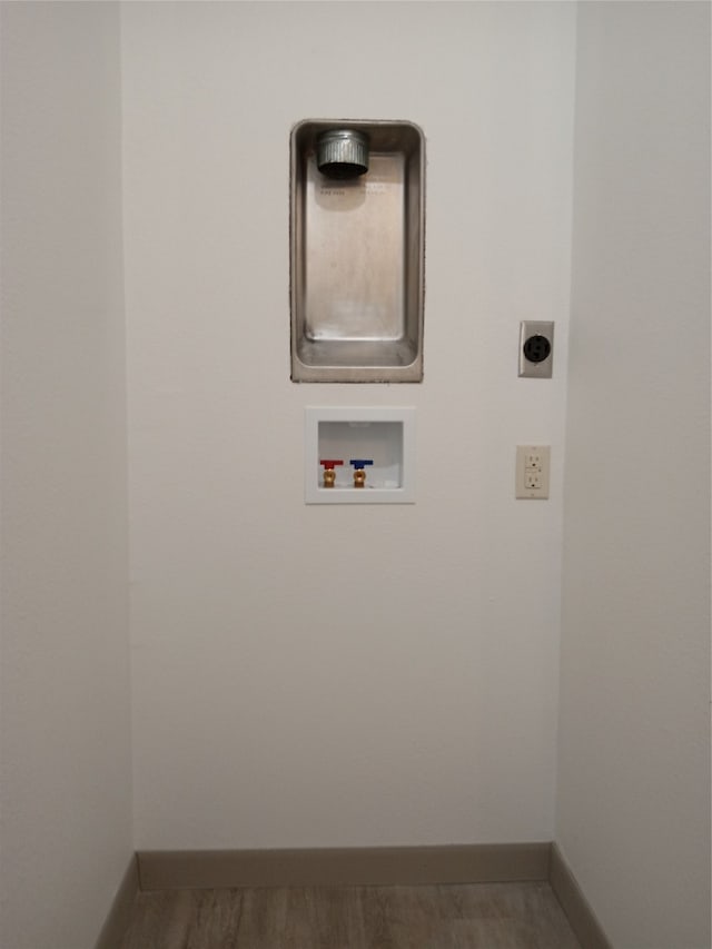 laundry room featuring hookup for an electric dryer, washer hookup, and hardwood / wood-style flooring