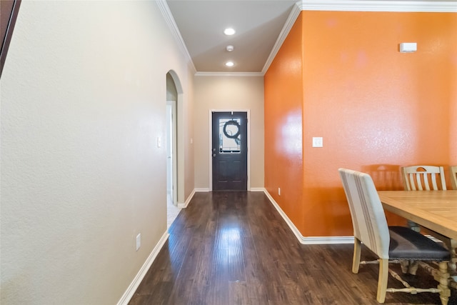 interior space featuring ornamental molding and dark wood-type flooring