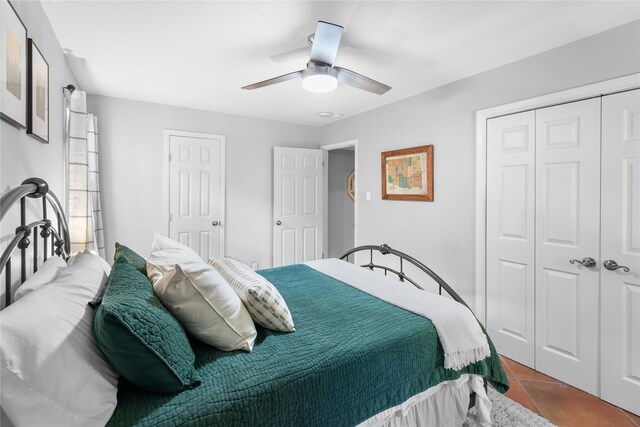 bedroom with tile patterned flooring and ceiling fan