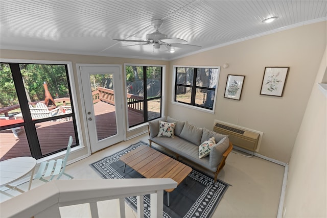 sunroom / solarium with a wall mounted AC and ceiling fan