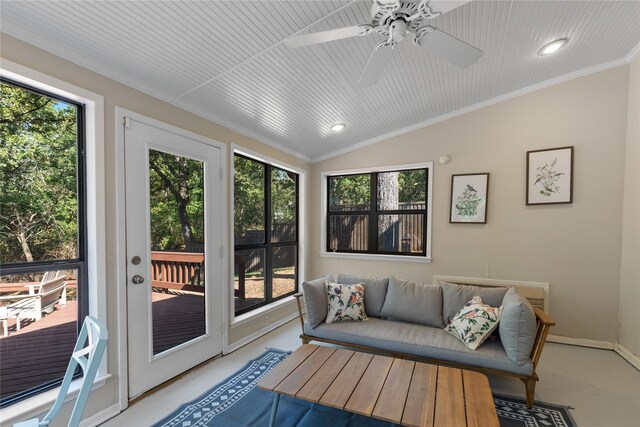 sunroom with plenty of natural light, ceiling fan, and vaulted ceiling