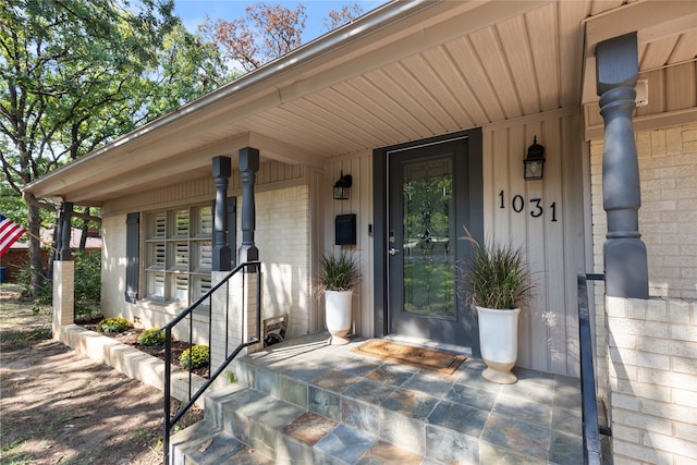 doorway to property with a porch