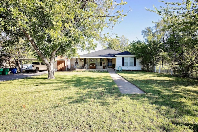 ranch-style home with covered porch and a front lawn