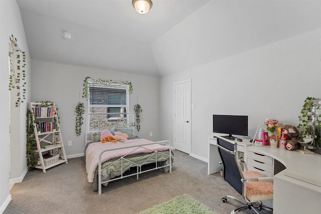 carpeted bedroom featuring lofted ceiling