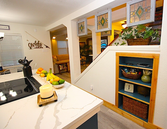 kitchen featuring cooktop and light hardwood / wood-style flooring