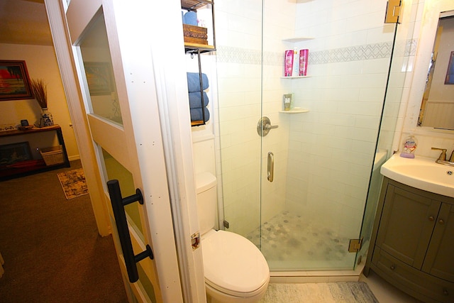 full bath with a shower stall, toilet, and vanity