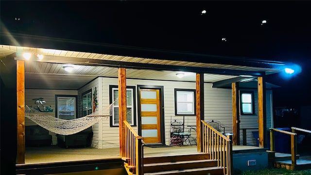 exterior entry at night with covered porch