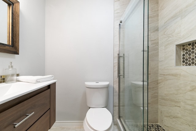 bathroom featuring walk in shower, vanity, and toilet