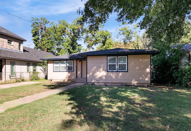 ranch-style house with a front lawn