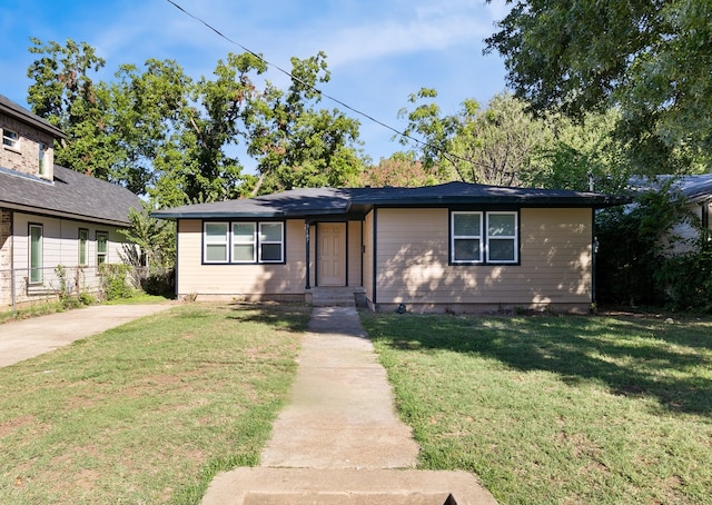 ranch-style house with a front yard