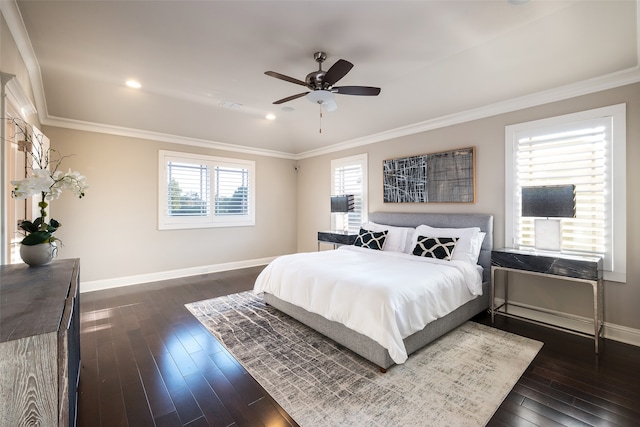 bedroom featuring multiple windows, ceiling fan, crown molding, and dark wood-type flooring