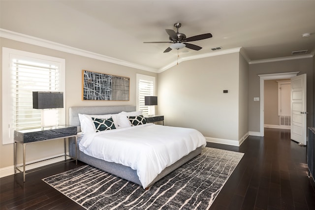 bedroom with dark hardwood / wood-style floors, multiple windows, ornamental molding, and ceiling fan