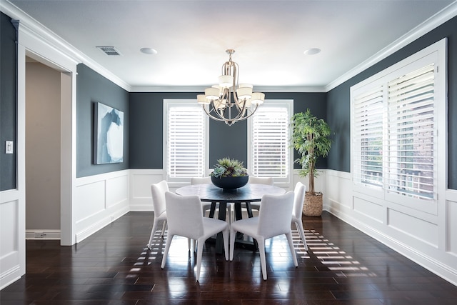 dining space with a notable chandelier, dark hardwood / wood-style flooring, and ornamental molding