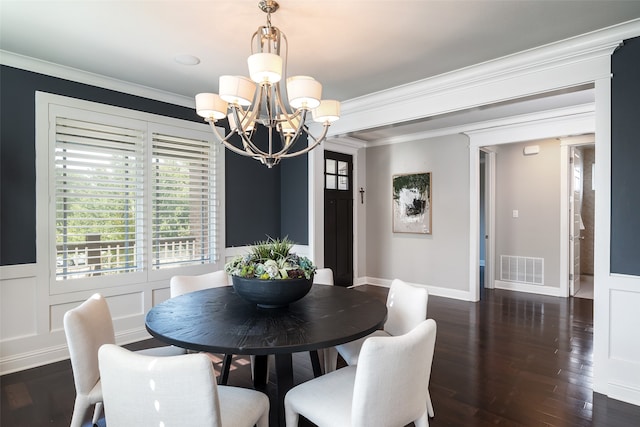 dining room featuring a notable chandelier, dark hardwood / wood-style floors, and ornamental molding