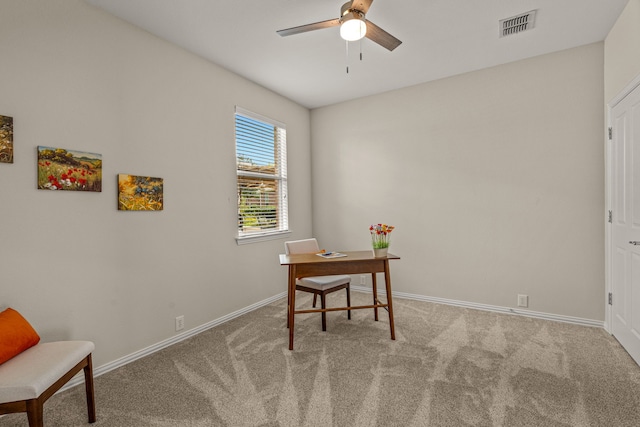 home office featuring ceiling fan and light colored carpet