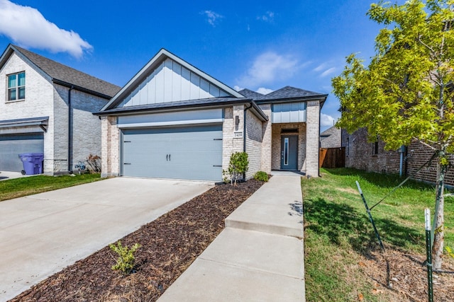 view of front of house with a garage and a front yard