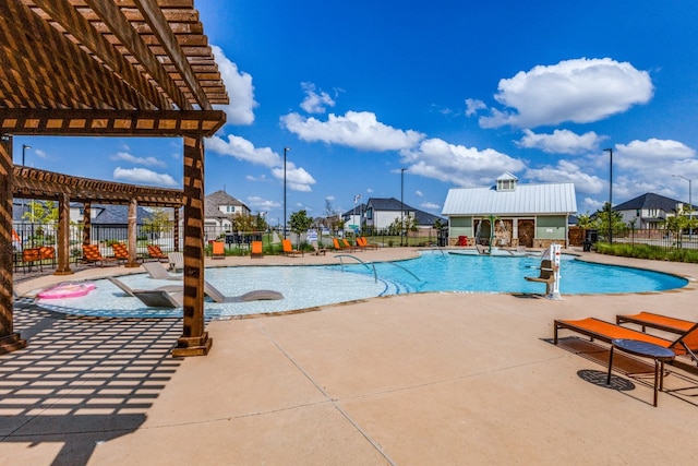 view of swimming pool featuring a pergola and a patio area