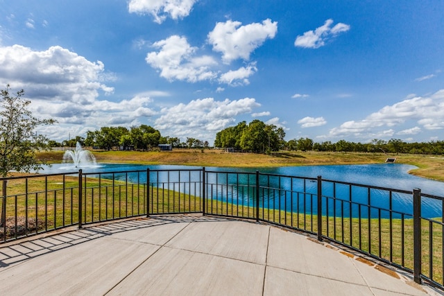 view of patio featuring a water view